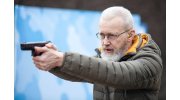 Виталий Крючин с пистолетом
